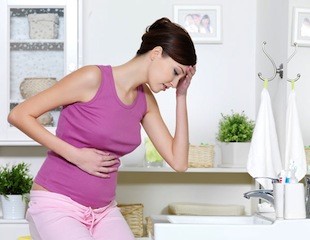 Причины и лечение боли желудка при беременности